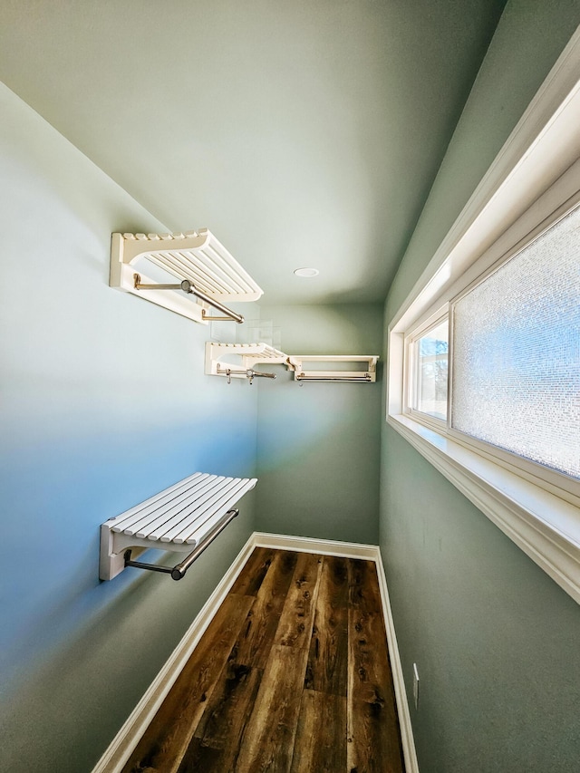 spacious closet with wood finished floors