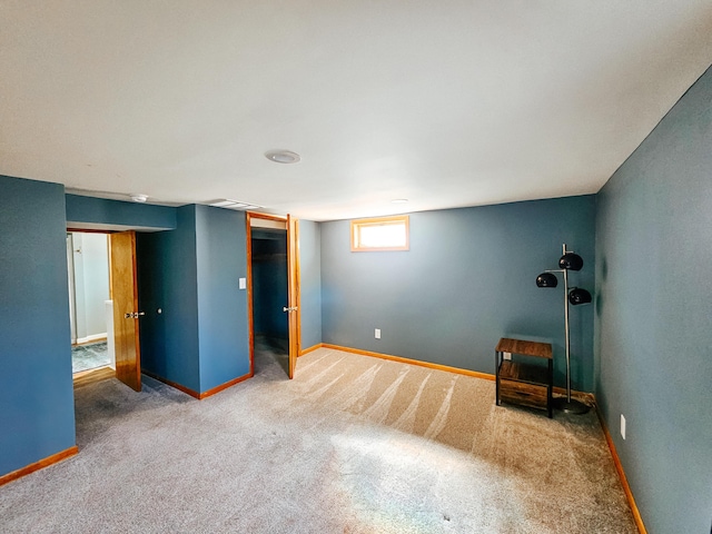 unfurnished bedroom featuring baseboards and carpet floors