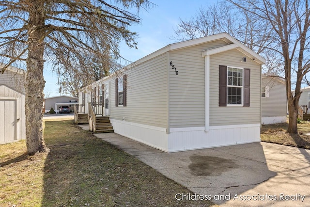 6516 Bayonet Ave SW, Grand Rapids, MI 49548 - view of side of property featuring a patio