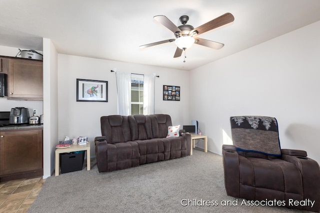 living room with light carpet and ceiling fan