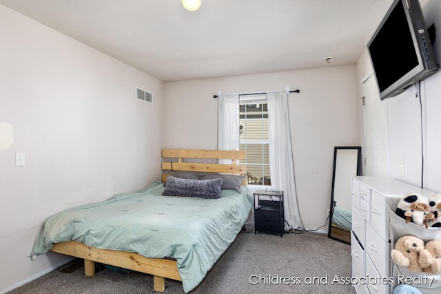 bedroom with visible vents and light colored carpet