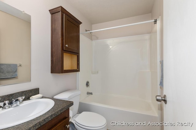 full bathroom with vanity, bathing tub / shower combination, and toilet