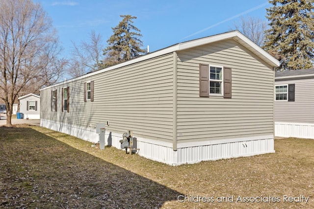 view of home's exterior featuring a yard