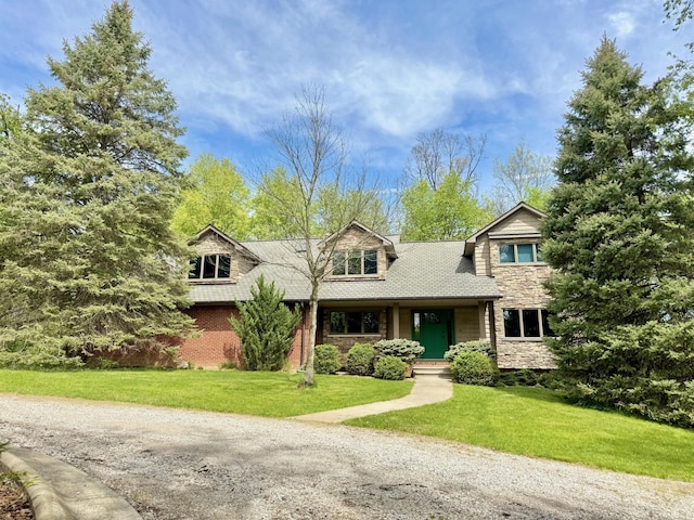 5557 N Territorial Rd, Ann Arbor, MI 48105 - view of front of property with a front lawn, stone siding, and covered porch
