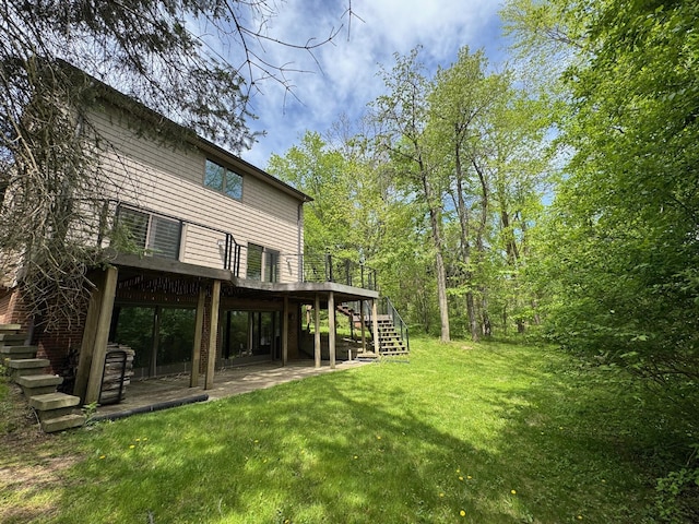 5557 N Territorial Rd, Ann Arbor, MI 48105 - rear view of property featuring stairs, a deck, a yard, and a patio area
