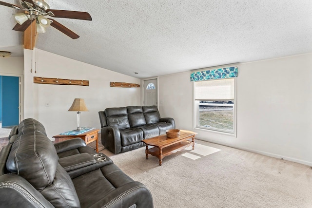 living area featuring ceiling fan, a textured ceiling, lofted ceiling, and carpet floors