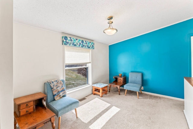 living area featuring visible vents, a textured ceiling, baseboards, and carpet