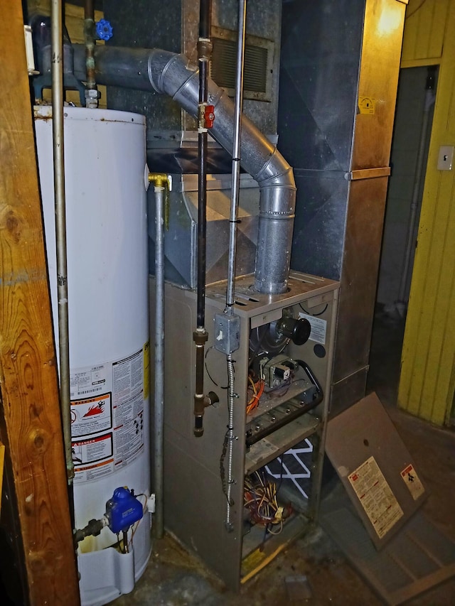 utility room with water heater