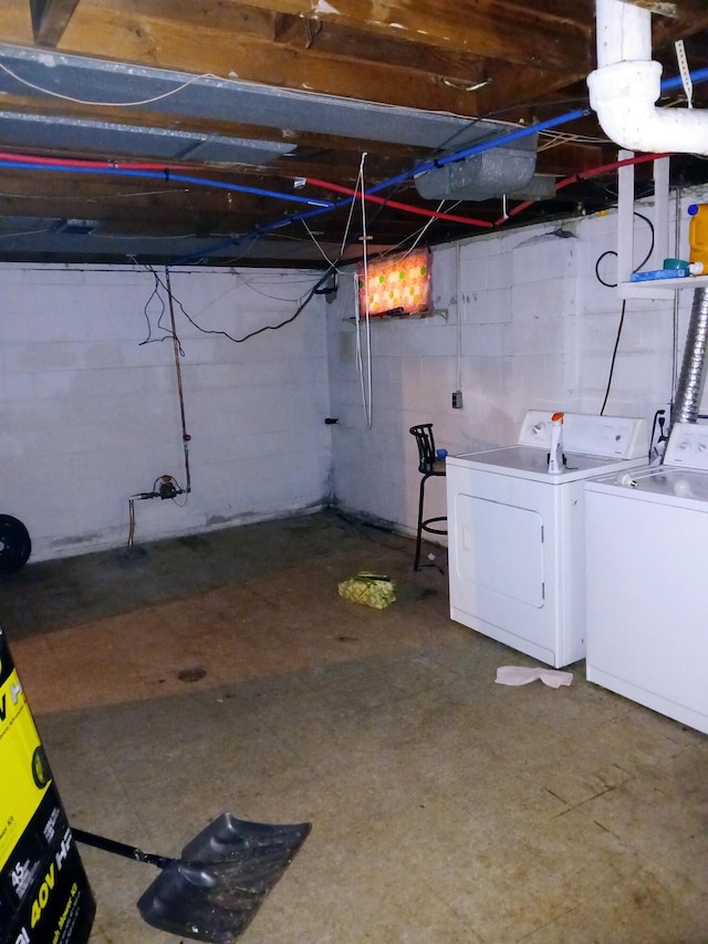 unfinished basement with independent washer and dryer