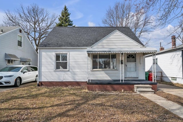 view of front of property featuring roof with shingles