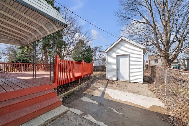 exterior space with a storage unit and fence