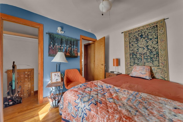 bedroom with ceiling fan and wood finished floors