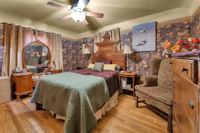 bedroom with light wood-type flooring and ceiling fan