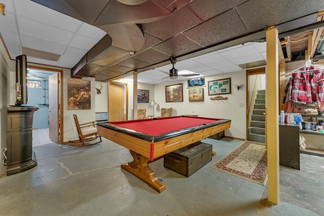 recreation room featuring unfinished concrete floors, billiards, and a paneled ceiling