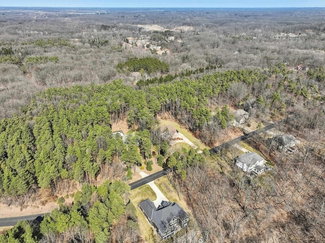 bird's eye view featuring a forest view