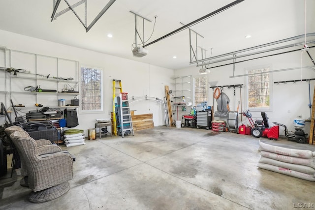 garage featuring recessed lighting and a garage door opener