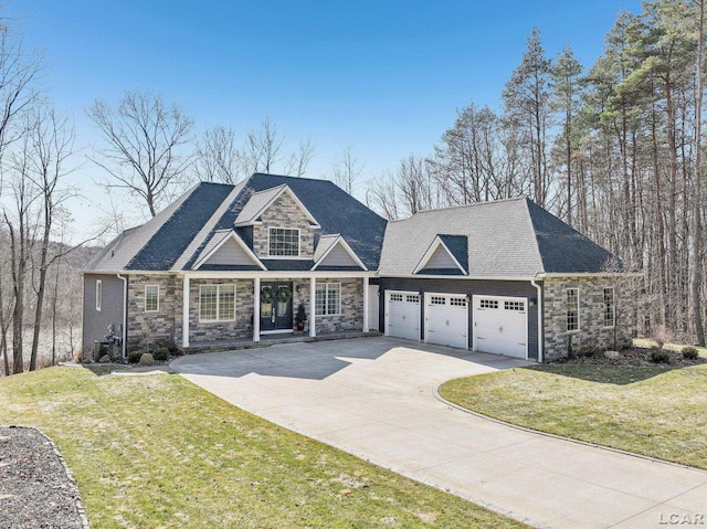 view of front of property featuring stone siding, an attached garage, concrete driveway, and a front yard