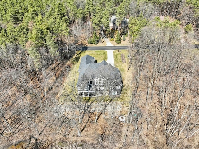 aerial view featuring a wooded view