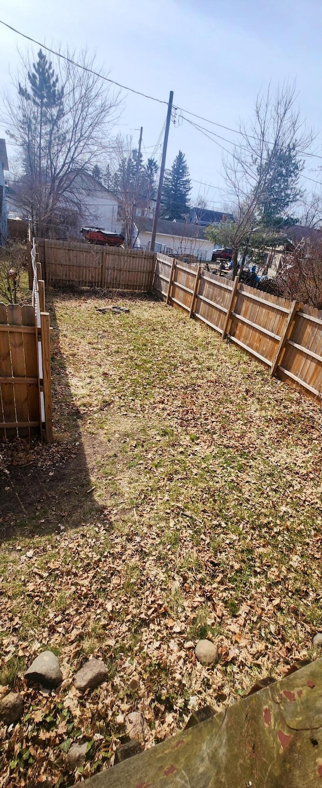 view of yard featuring a fenced backyard