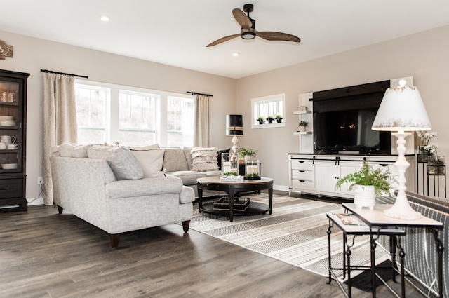 living room featuring recessed lighting, a ceiling fan, and wood finished floors