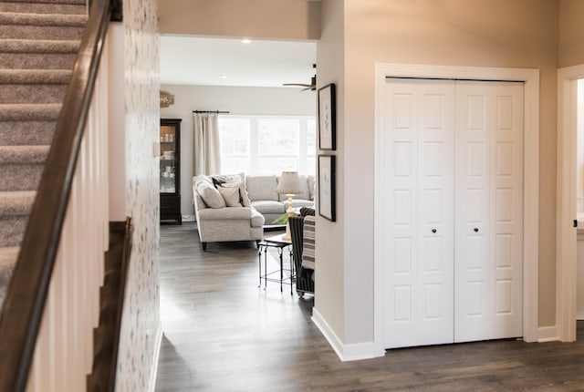 stairway with recessed lighting, wood finished floors, and baseboards