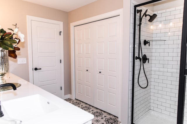 full bath featuring a shower stall and a sink