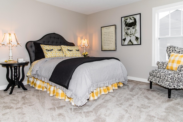 bedroom with baseboards and carpet floors