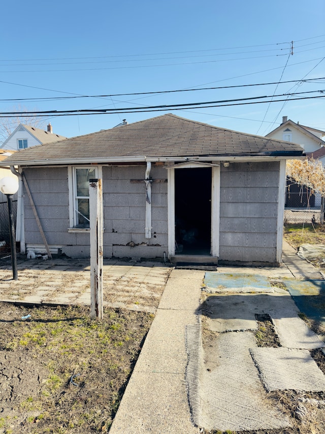 view of front of house with roof with shingles