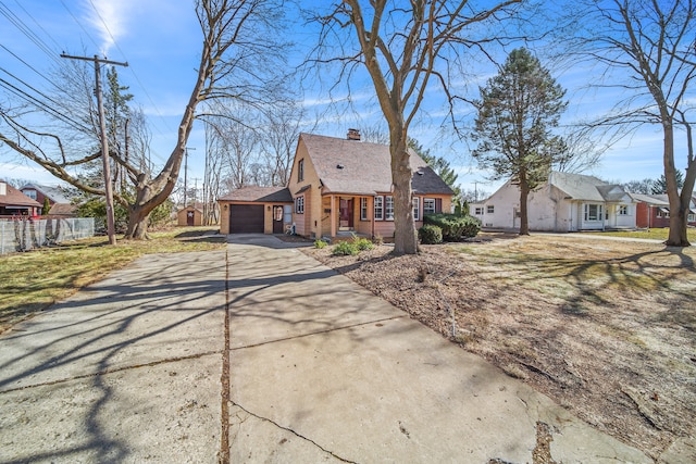 view of front of house with fence, driveway, an attached garage, a shingled roof, and a chimney