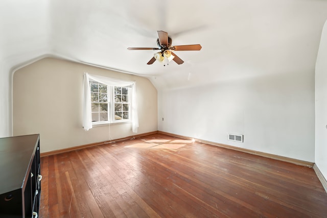 bonus room featuring visible vents, baseboards, ceiling fan, vaulted ceiling, and hardwood / wood-style floors