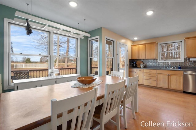 dining space featuring recessed lighting and light wood-style flooring