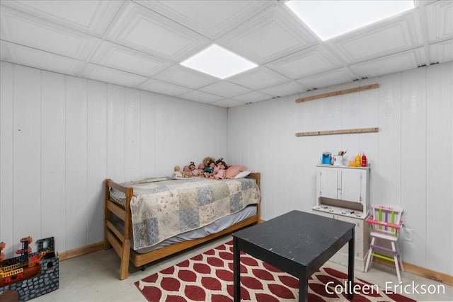 bedroom featuring concrete floors