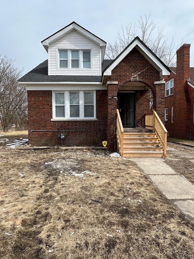 view of front of property featuring brick siding