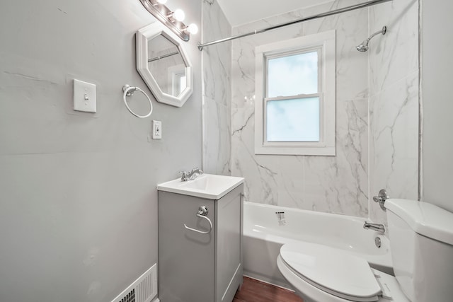 full bath with visible vents, shower / washtub combination, toilet, and vanity