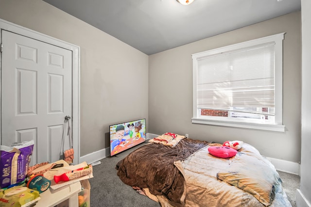 carpeted bedroom with baseboards