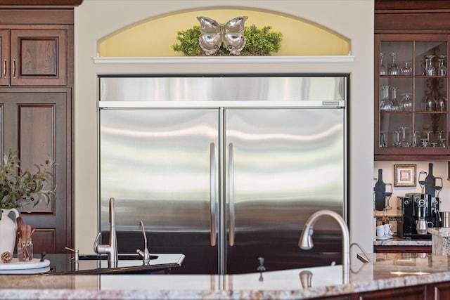2122 Grange Rd, Buchanan, MI 49107 - kitchen featuring built in refrigerator and light stone countertops