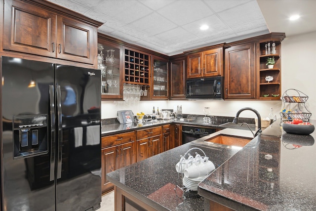 2122 Grange Rd, Buchanan, MI 49107 - kitchen featuring black appliances, open shelves, a sink, glass insert cabinets, and dark stone counters