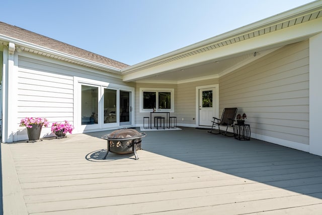2122 Grange Rd, Buchanan, MI 49107 - wooden deck with an outdoor fire pit