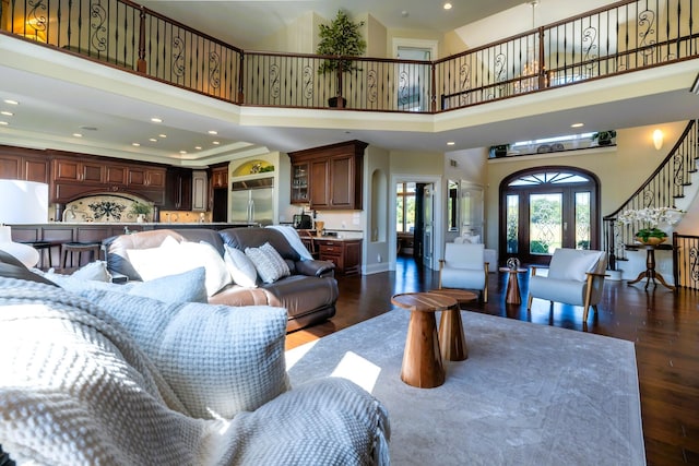 2122 Grange Rd, Buchanan, MI 49107 - living area featuring dark wood-style floors, a high ceiling, recessed lighting, and stairs