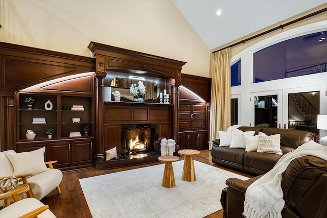 2122 Grange Rd, Buchanan, MI 49107 - living area featuring high vaulted ceiling, a high end fireplace, dark wood-style flooring, and recessed lighting