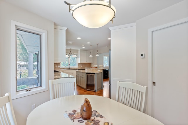 dining space featuring recessed lighting and light wood-type flooring