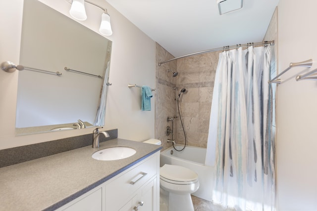 bathroom featuring vanity, toilet, visible vents, and shower / bath combo with shower curtain