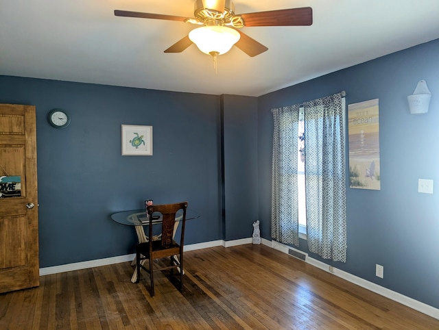 sitting room with ceiling fan, baseboards, and hardwood / wood-style floors