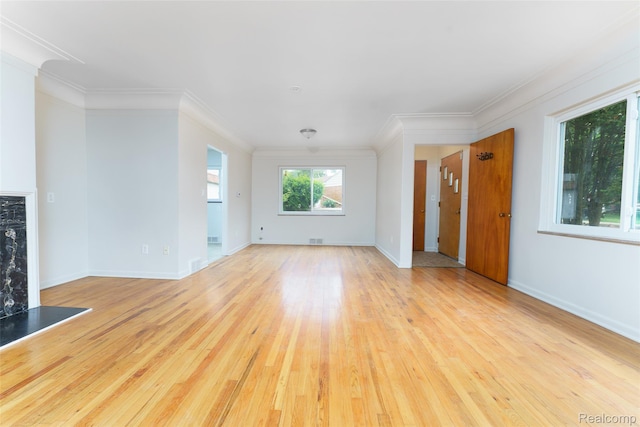2810 Otsego Rd, Waterford, MI 48328 - unfurnished living room with light wood-style flooring, crown molding, and a premium fireplace