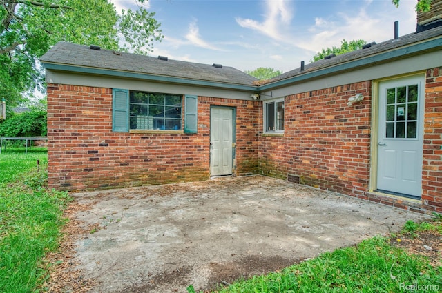 2810 Otsego Rd, Waterford, MI 48328 - rear view of house featuring a patio area and brick siding