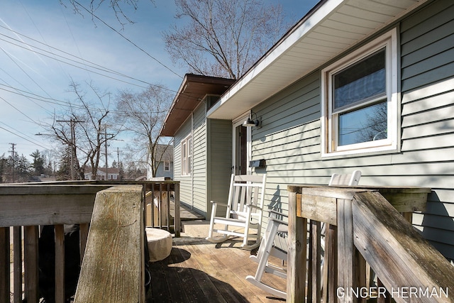 view of home's exterior featuring a wooden deck