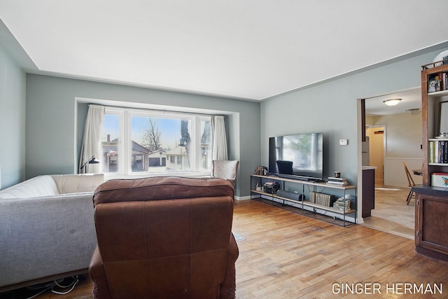 living room with wood finished floors and baseboards