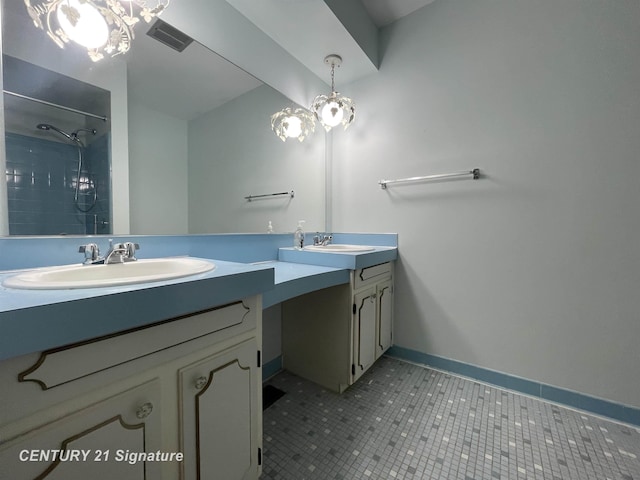 full bathroom featuring visible vents, a sink, a tile shower, tile patterned flooring, and double vanity