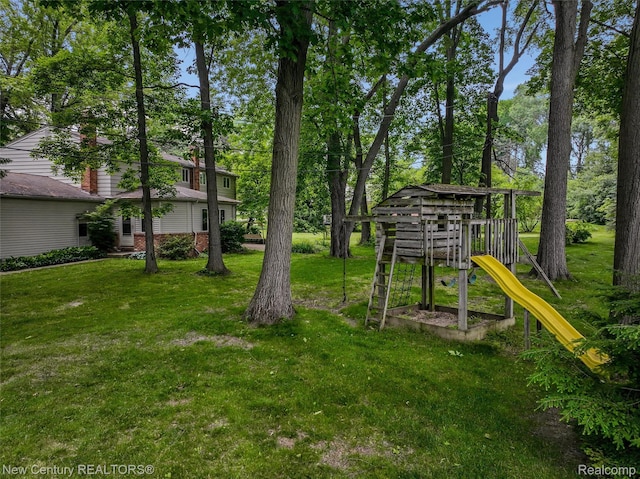 6750 Limerick Ln, Troy, MI 48098 - view of green lawn with a playground