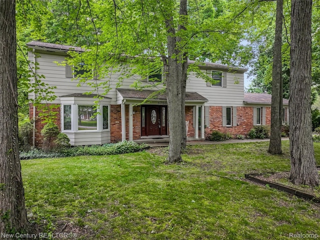 6750 Limerick Ln, Troy, MI 48098 - view of front of house featuring brick siding and a front yard